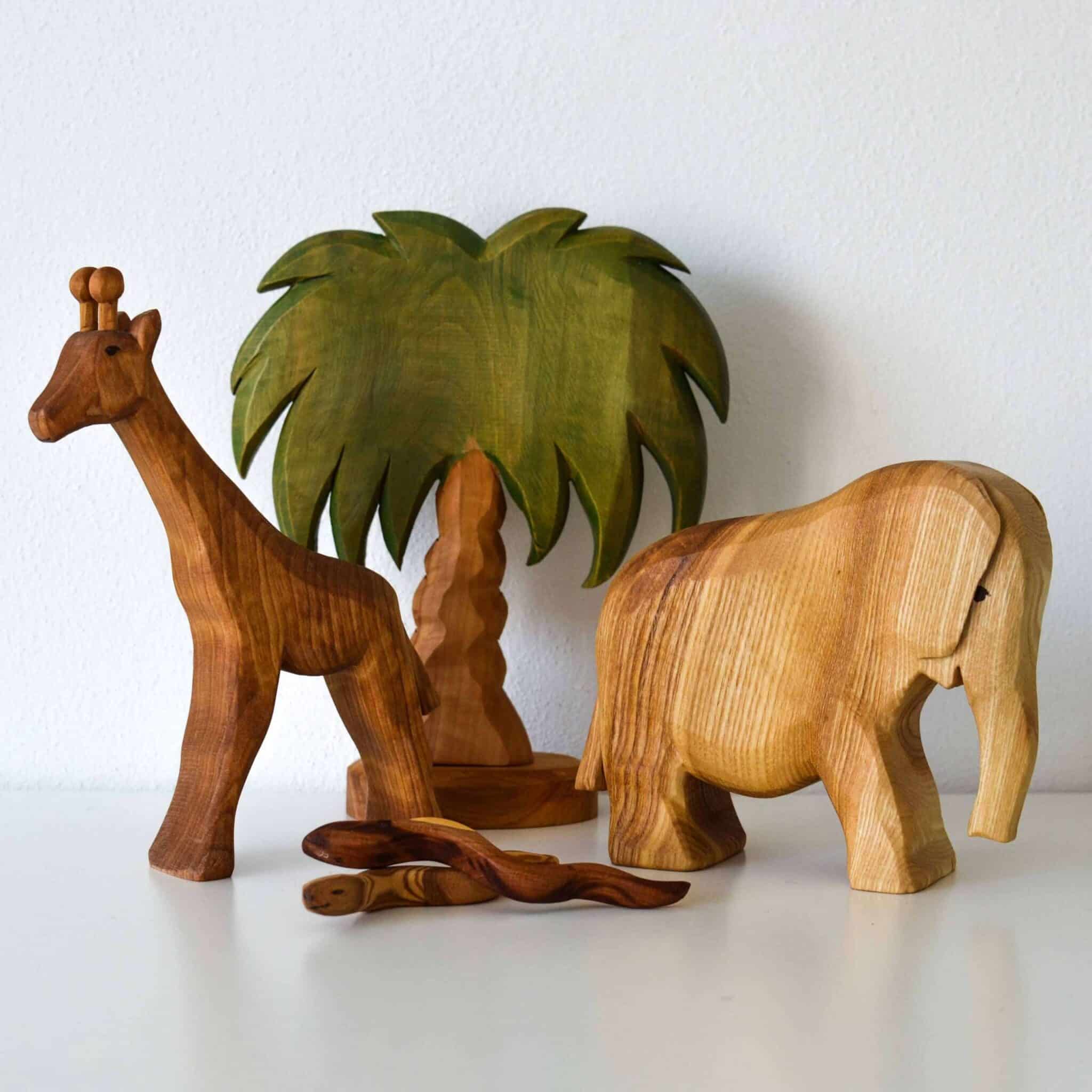 Predan giraffe, large elephant and palm tree