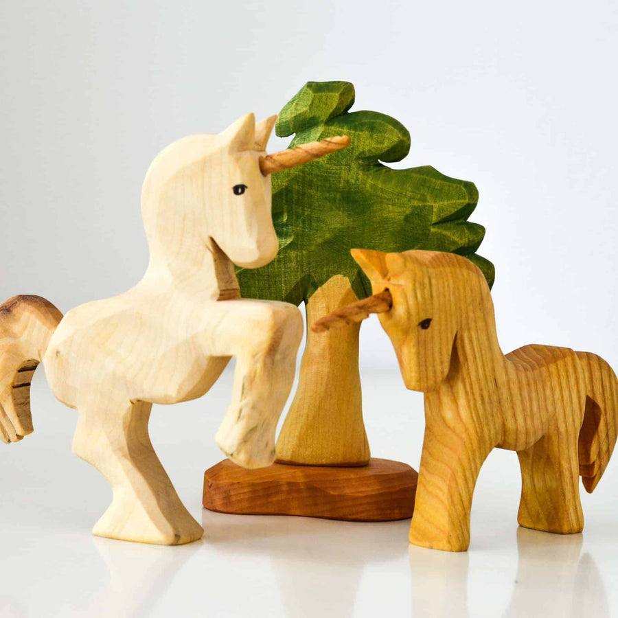 Predan wooden unicorns and leafy tree